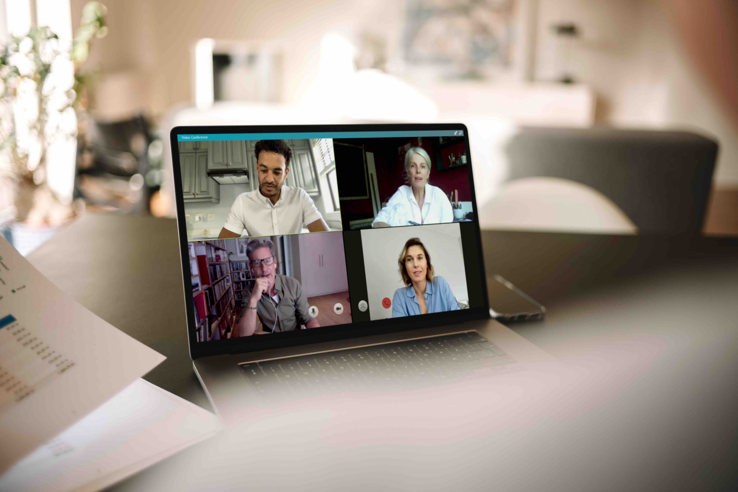 Business people having online meeting. Group of men and woman having a video conference over a laptop.